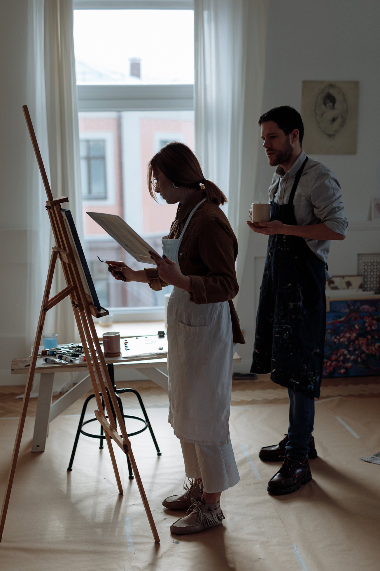 Painters looking at a Painting